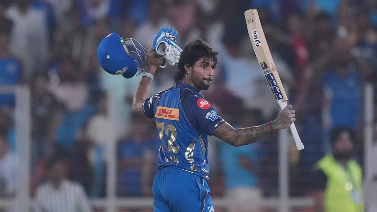 Mumbai Indians' Tilak Verma celebrates his century during the Indian Premier League cricket match between Gujarat Titans and Mumbai Indians in Ahmedabad. - AP Photo