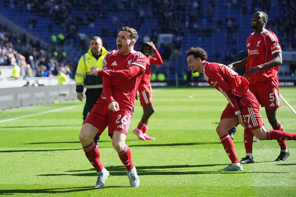 | Photo: AP/Ian Hodgson : Liverpool's Andrew Robertson, front, and teammate celebrate with fans after the English Premier League soccer match between Everton and Liverpool in Liverpool, England.