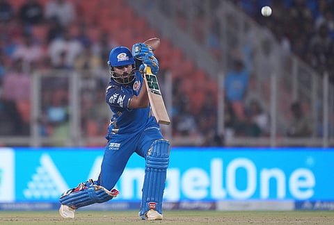 Mumbai Indians' Naman Dhir plays a shot during the Indian Premier League cricket match between Gujarat Titans and Mumbai Indians in Ahmedabad.