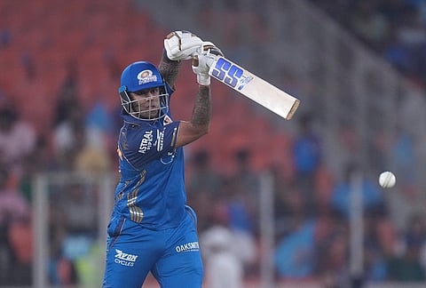 Mumbai Indians' Suryakumar Yadav plays a shot during the Indian Premier League cricket match between Gujarat Titans and Mumbai Indians in Ahmedabad.