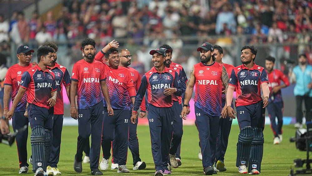 The Nepal cricket team walks back to the pavilion after defeating Scotland during the T20 World Cup cricket match in Mumbai. - | Photo: AP/Rafiq Maqbool
