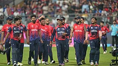 The Nepal cricket team walks back to the pavilion after defeating Scotland during the T20 World Cup cricket match in Mumbai. - | Photo: AP/Rafiq Maqbool