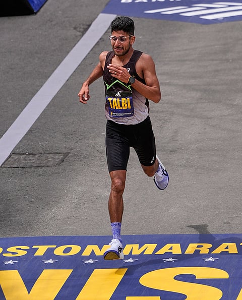 Zouhair Talbi, Moroccan-born American runner, crosses the finish line in fifth place at the Boston Marathon, in Boston.