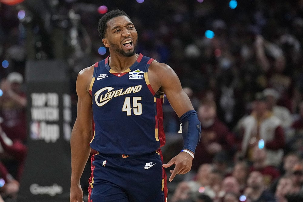Cleveland Cavaliers guard Donovan Mitchell (45) gestures to the crowd in the first half in Game 2 of a first-round NBA basketball playoffs series against the Toronto Raptors in Cleveland. - | Photo; AP/Sue Ogrocki