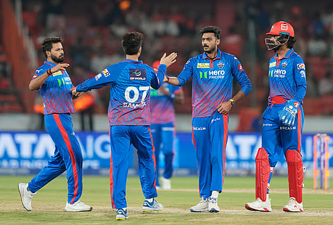 Delhi Capitals' captain Axar Patel, second right, celebrate with teammates the wicket of Sunrisers Hyderabad's Travis Head during the Indian Premier League cricket match between Sunrisers Hyderabad and Delhi Capitals in Hyderabad.