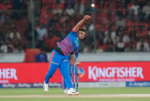 Delhi Capitals' Nitish Rana bowls a delivery during the Indian Premier League cricket match between Sunrisers Hyderabad and Delhi Capitals in Hyderabad.