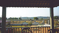 Green Step Farms by Ram Rattan Group in Naugaon, a nature-centric farmhouse community set amid the Aravalli landscape.