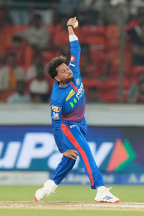 Delhi Capitals' Kuldeep Yadav bowls a delivery during the Indian Premier League cricket match between Sunrisers Hyderabad and Delhi Capitals in Hyderabad.
