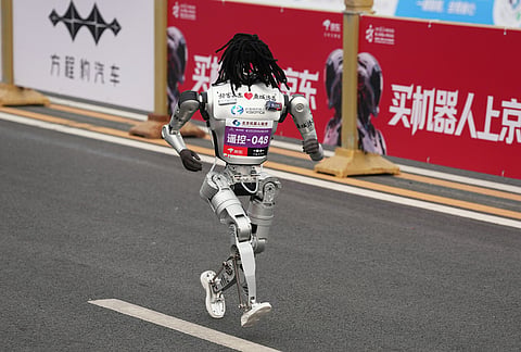 A robot starts off for the Beijing E-Town Half Marathon and Humanoid Half Marathon on the outskirts of Beijing.