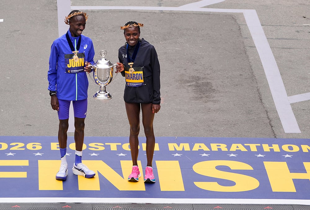 Boston Marathon winner John Korir of Kenya, left, holds the trophy with women's division winner Sharon Lokedi, also of Kenya, at the finish line of the Boston Marathon, in Boston.  - | Photo: AP/Charles Krupa
