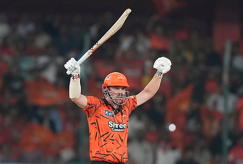 Sunrisers Hyderabad's Travis Head celebrates after hits a six during the Indian Premier League cricket match between Sunrisers Hyderabad and Delhi Capitals in Hyderabad.