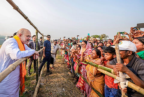 Union Home Minister Amit Shah interacts with people during a public meeting, on the eve of first phase of West Bengal Assembly elections, at Saptagram constituency, in Hooghly district. 