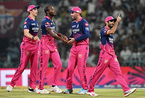 Rajasthan Royals' Jofra Archer, second left, celebrates with teammates the wicket of Lucknow Super Giants' Aiden Markram during the Indian Premier League cricket match between Lucknow Super Giants and Rajasthan Royals in Lucknow.