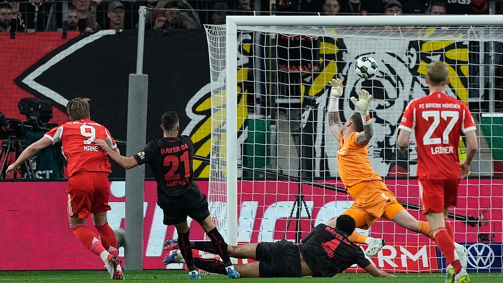 Bayern's Harry Kane scores his side's opening goal during the German Soccer Cup semifinal match between Bayer Leverkusen and Bayern Munich in Leverkusen, Germany, Wednesday, April 22, 2026. - A Photo/Martin Meissner