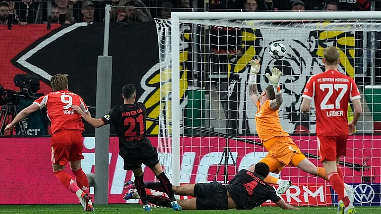 Bayern's Harry Kane scores his side's opening goal during the German Soccer Cup semifinal match between Bayer Leverkusen and Bayern Munich in Leverkusen, Germany, Wednesday, April 22, 2026. - A Photo/Martin Meissner