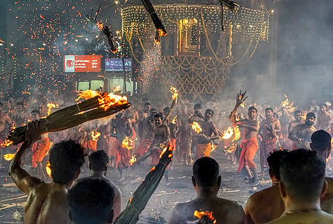 People perform 'Thootedara', a centuries-old intense fire-throwing ritual, during the annual 'Kateel Jatre' festival of Durgaparameshwari Temple, at Kateel, in Dakshina Kannada district, Karnataka.