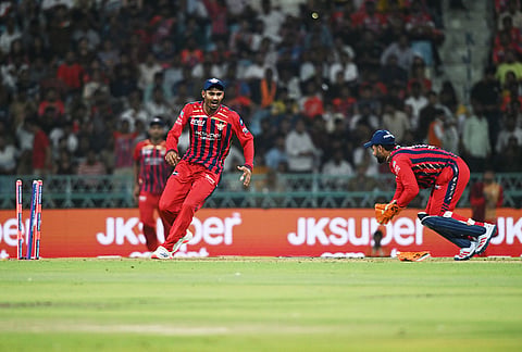 Lucknow Super Giants' captain Rishabh Pant, right, attempts unsuccessfully to run Rajasthan Royals' Donovan Ferreira out during the Indian Premier League cricket match between Lucknow Super Giants and Rajasthan Royals in Lucknow.