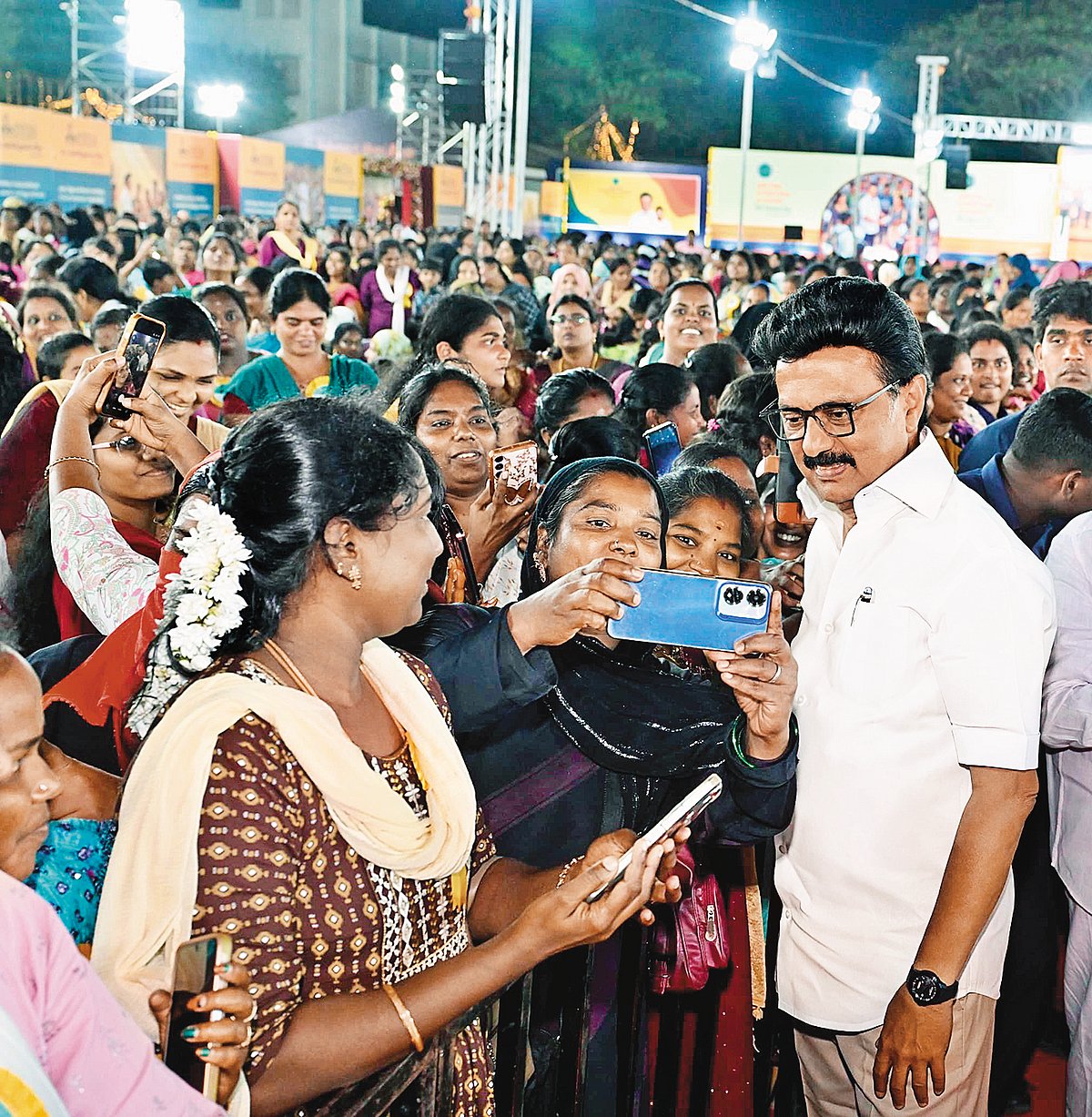 M.K. Stalin with women clicking selfies