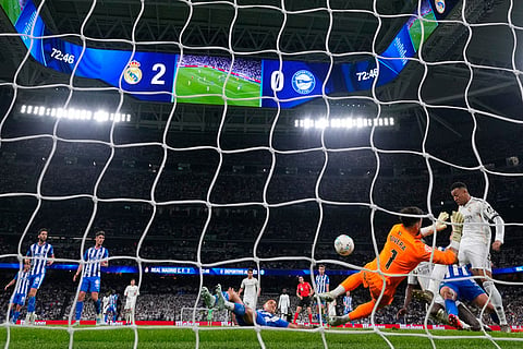 Alaves' goalkeeper Antonio Sivera saves in front pf Real Madrid's Kylian Mbappeduring a La Liga soccer match between Real Madrid and Alaves in Madrid, Spain.