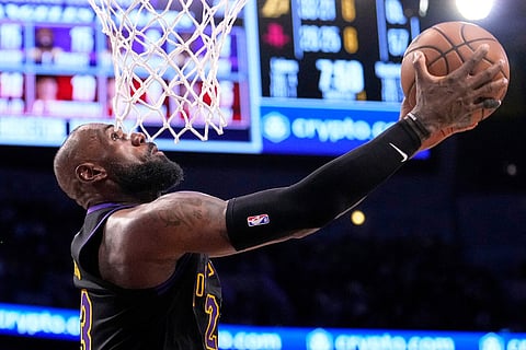 Los Angeles Lakers forward LeBron James shoots during the second half in Game 2 of a first-round NBA playoffs basketball series against the Houston Rockets in Los Angeles.
