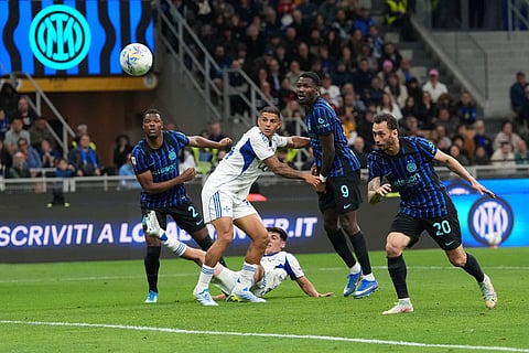 Inter Milan's Hakan Calhanoglu scores his side's second goal during the Italian Cup, return-leg soccer match between Inter Milan and Como, in Milan, Italy.