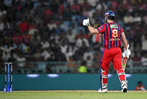 Lucknow Super Giants' Mitchell Marsh celebrates his fifty runs during the Indian Premier League cricket match between Lucknow Super Giants and Rajasthan Royals in Lucknow.