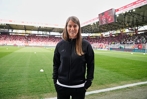 New head coach of German Bundesliga soccer club 1. FC Union Berlin Marie-Louise Eta looks on during the warm up prior to the German Bundesliga soccer match between FC Union Berlin and Wolfsburg in Berlin, Germany, Saturday, April 18, 2026. 