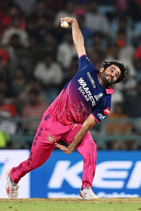 Rajasthan Royals' Ravi Bishnoi bowls a delivery during the Indian Premier League cricket match between Lucknow Super Giants and Rajasthan Royals in Lucknow.
