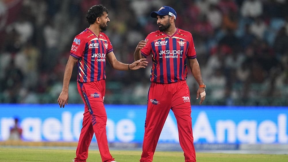 | Photo: AP/Manish Swarup : Lucknow Super Giants' Prince Yadav, left, speaks to teammate Mohammed Shami during the Indian Premier League cricket match between Lucknow Super Giants and Delhi Capitals in Lucknow, India.