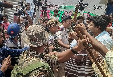 Security personnel present at the site after clashes broke out between supporters of the Aam Janata Unnayan Party (AJUP) and the ruling TMC during the first phase of the West Bengal Assembly elections, at Naoda, in Murshidabad district, Thursday, April 23, 2026. 