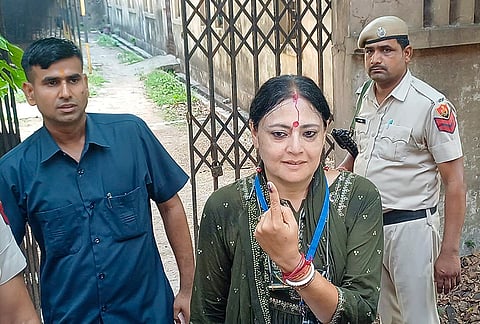 BJP candidate from Asansol constituency, Agnimitra Paul, shows her ink-marked finger after casting a vote in the first phase of the West Bengal Assembly elections, at a polling station in Asansol. 