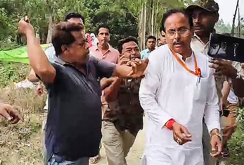 BJP candidate Suvendu Sarkar being allegedly manhandled while heading to a polling booth following reports of disturbances, during the first phase of the West Bengal Assembly elections, in Dakshin Dinajpur district.