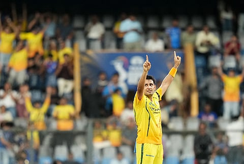 Chennai Super Kings' Anshul Kamboj celebrates the wicket of Mumbai Indians' Shardul Thakur during the Indian Premier League cricket match between Mumbai Indians and Chennai Super Kings in Mumbai.