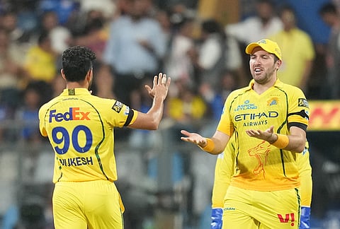 Chennai Super Kings' Mukesh Choudhary celebrates the wicket of Mumbai Indians' Quinton de Kock during the Indian Premier League cricket match between Mumbai Indians and Chennai Super Kings in Mumbai.