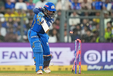 Mumbai Indians' Quinton de Kock bowled out by Chennai Super Kings' Mukesh Choudhary during the Indian Premier League cricket match between Mumbai Indians and Chennai Super Kings in Mumbai.