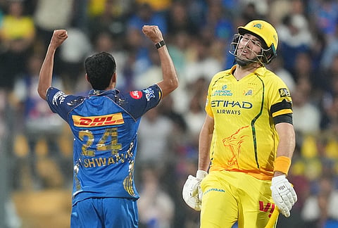 Mumbai Indians' Ashwani Kumar celebrates the wicket of Chennai Super Kings' Jamie Overton, right, during the Indian Premier League cricket match between Mumbai Indians and Chennai Super Kings in Mumbai.