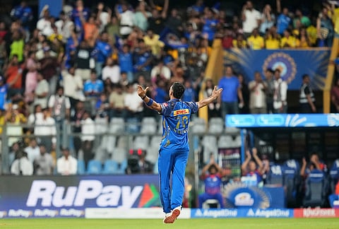 Mumbai Indians' Allah Ghazanfar celebrates the wicket of Chennai Super Kings' captain Ruturaj Gaikwad during the Indian Premier League cricket match between Mumbai Indians and Chennai Super Kings in Mumbai.
