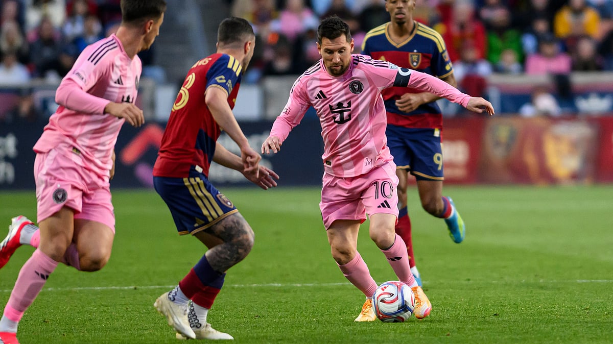 Inter Miami midfielder Lionel Messi (10) controls the ball as he works through the defense of Real Salt Lake defender Alexandros Katranis, center left. - AP