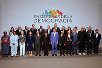 When History Happens, Sometimes You Know It Joan Monfort : Spain's Prime Minister Pedro Sanchez, center, poses with attendees at the Meeting in Defence of Democracy summit in Barcelona, Spain, Saturday, April 18, 2026.