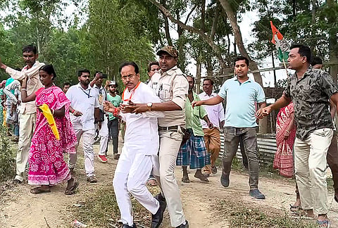 BJP candidate Suvendu Sarkar being allegedly manhandled while heading to a polling booth following reports of disturbances, during the first phase of the West Bengal Assembly elections, in Dakshin Dinajpur district.