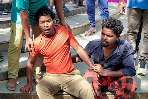 Family members of security guard Birsa Munda react after he was allegedly murdered by unidentified miscreants at Jagannathpur temple, in Ranchi.