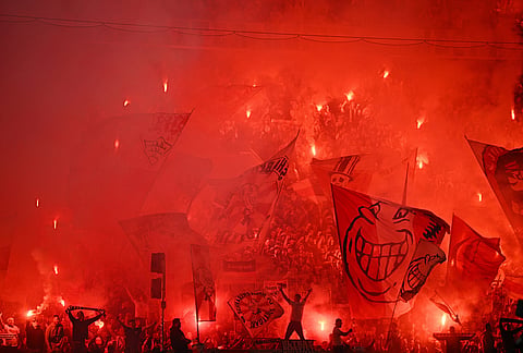Stuttgart fans set off pyrotechnics before a German Cup semifinal soccer match between VfB Stuttgart and SC Freiburg, in Stuttgart, Germany.