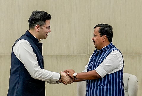 BJP National President Nitin Nabin, right, meets Rajya Sabha MP Raghav Chadha at the party's headquarters, in New Delhi.