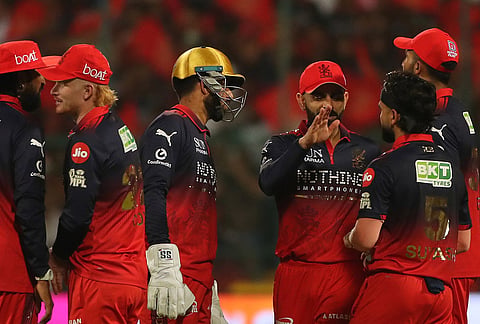 Royal Challengers Bengaluru's Suyash Sharma, second right, celebrates with teammates the wicket of Gujarat Titans' captain Shubman Gill during the Indian Premier League cricket match between Royal Challengers Bengaluru and Gujarat Titans in Bengaluru.