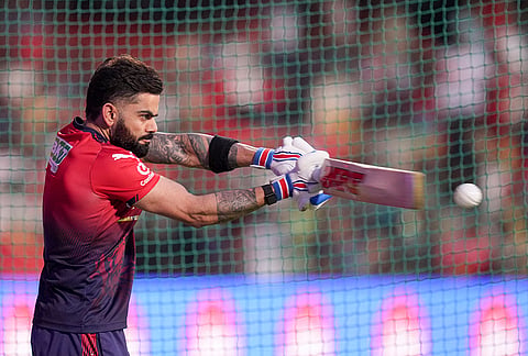 Royal Challengers Bengaluru's Virat Kohli warms up before an Indian Premier League (IPL) 2026 T20 cricket match between Royal Challengers Bengaluru and Gujarat Titans, in Bengaluru, Karnataka.