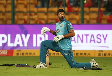Gujarat Titans' Washington Sundar warms up at the start of the the Indian Premier League cricket match between Royal Challengers Bengaluru and Gujarat Titans in Bengaluru.