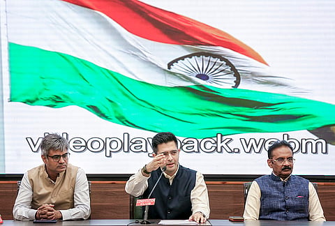 Rajya Sabha MP Raghav Chadha, centre, adddresses a press conference at the Constitution Club, in New Delhi. Rajya Sabha MPs Sandeep Pathak, left, and Ashok Mittal are also seen. 