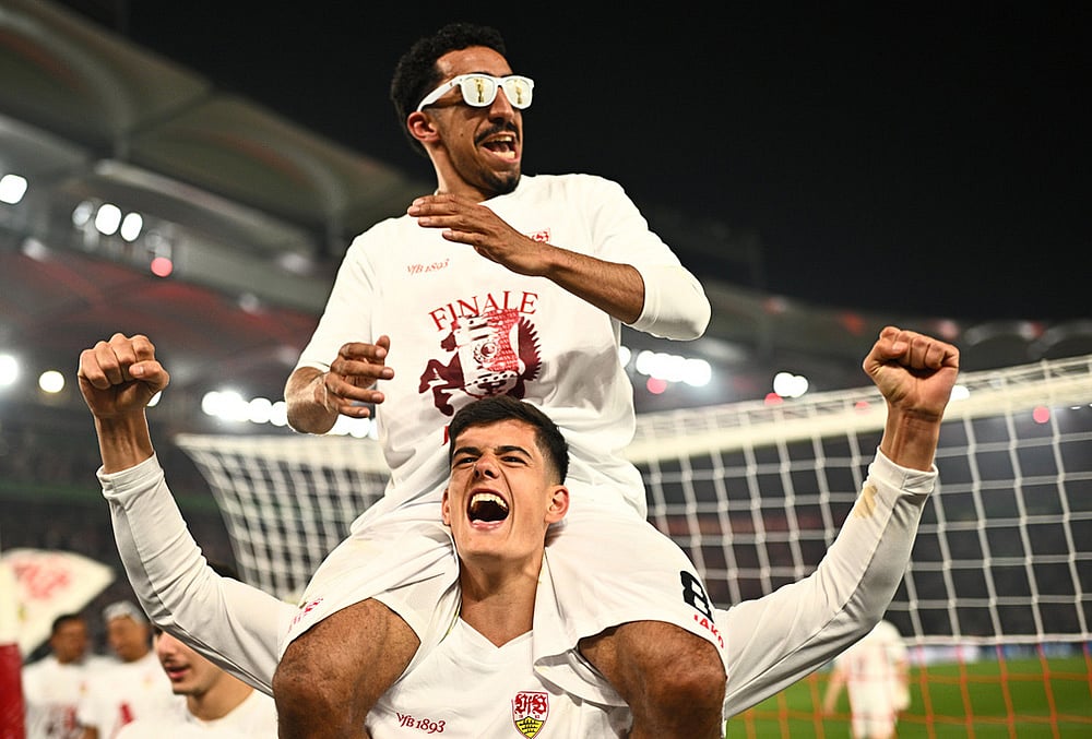 Stuttgart's Chema Andres, bottom, and and Tiago Tomas celebrate after a German Cup semifinal soccer match between VfB Stuttgart and SC Freiburg, in Stuttgart, Germany.  - | Photo: Tom Weller/dpa via AP
