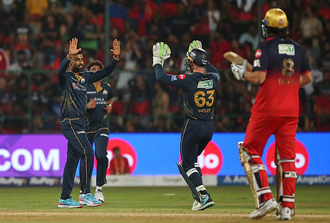 Gujarat Titans' Manav Suthar celebrates the wicket of Royal Challengers Bengaluru's captain Rajat Patidar during the Indian Premier League cricket match between Royal Challengers Bengaluru and Gujarat Titans in Bengaluru.