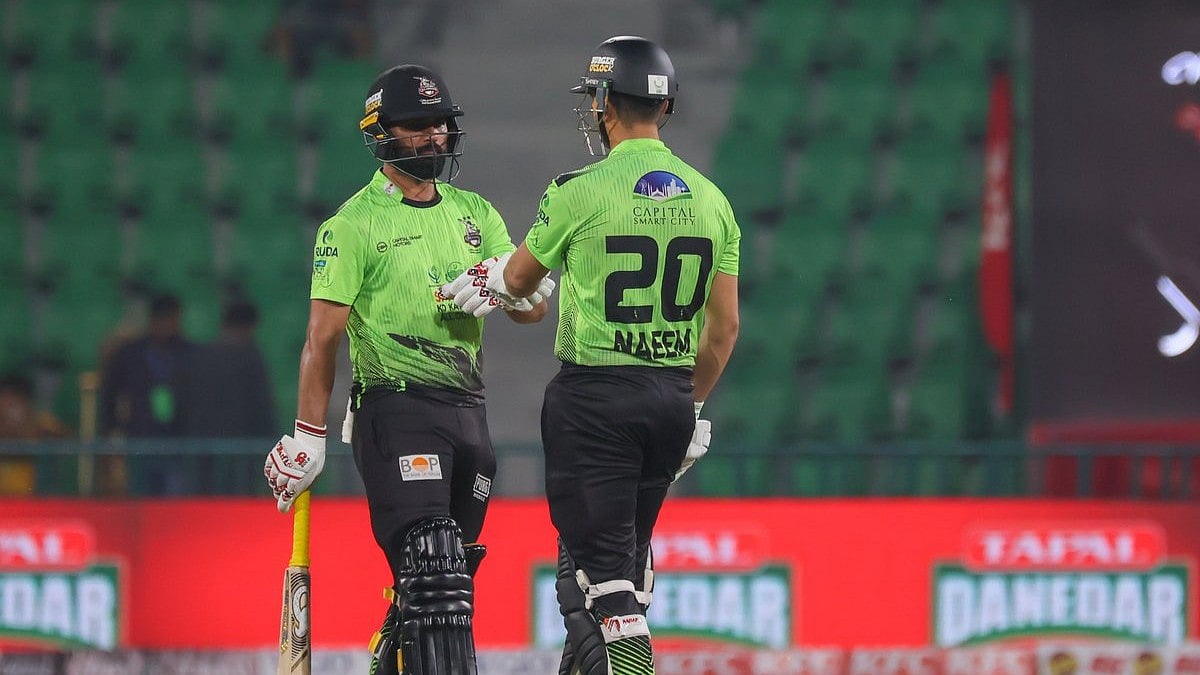 Lahore Qalandars cricketers in action against Peshawar Zalmi in PSL 2026 clash at the Gaddafi Stadium in Lahore.  - thepslt20/X